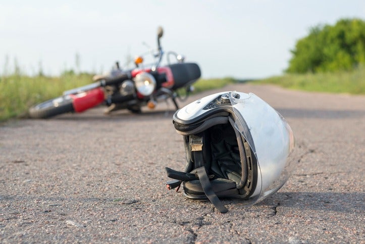 A helmet lies on the ground highlighting the context of an accident attorney in Riverside, CA
