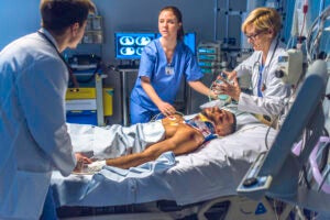 Doctors and nurses treating a patient experiencing catastrophic injuries in Riverside, CA