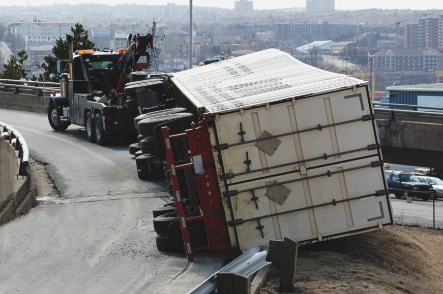 A Truck Container Fallen Sidewise On The Road In Riverside, CA