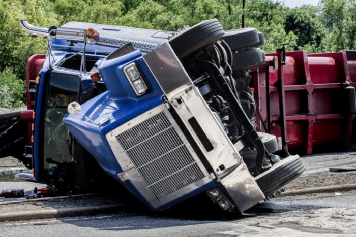 A Truck Fallen Upside Down On The Road In Riverside, CA